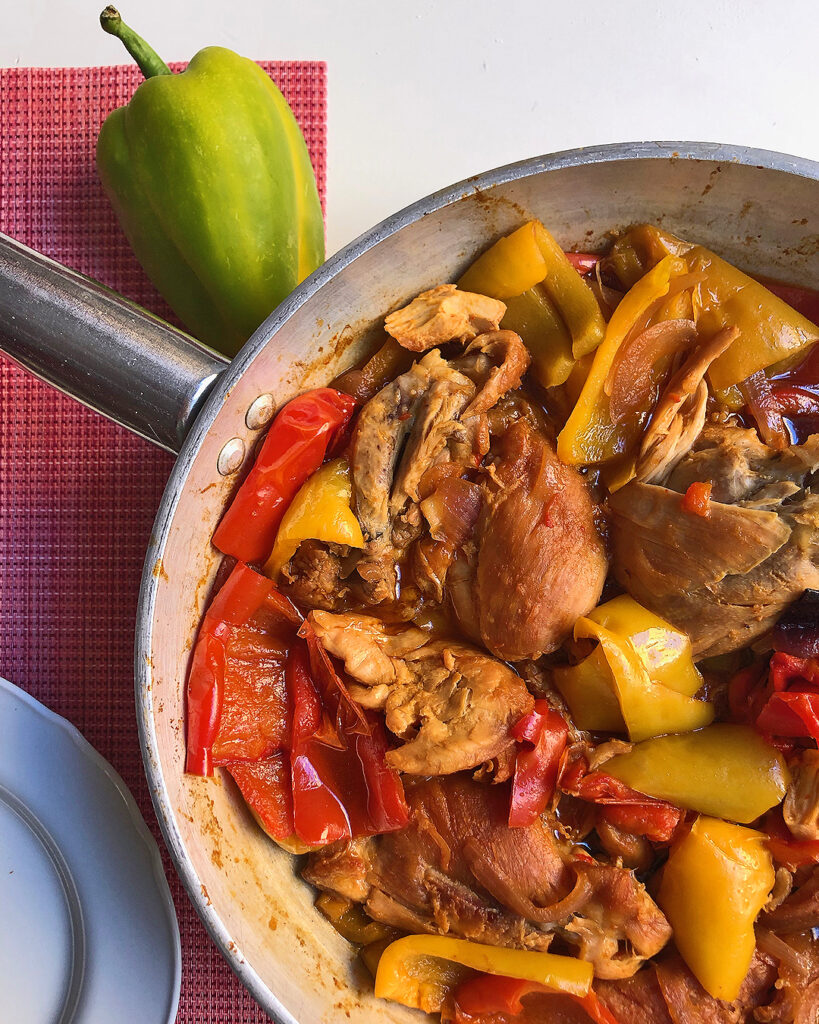 a pan full of chicken with bell pepper ready to be taste